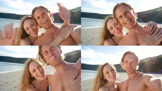 一对年轻夫妇在海滩上共度时光的4k视频片段