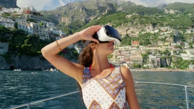 一名年轻女子在意大利度假期间坐在船上使用虚拟现实耳机的4k视频