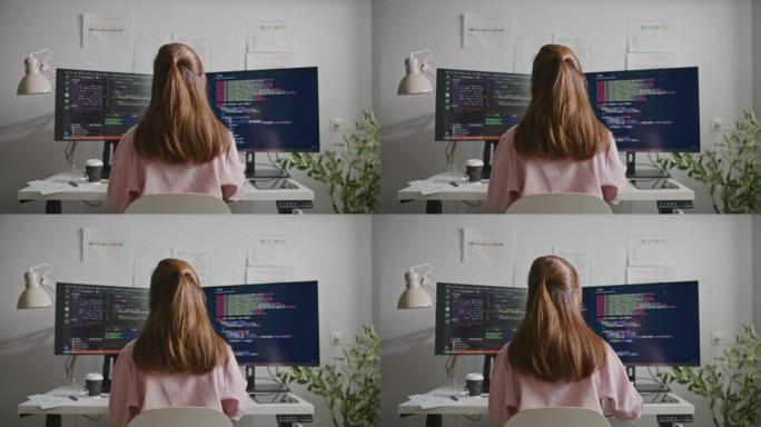 程序开发人员正在办公室的计算机上进行代码编程
