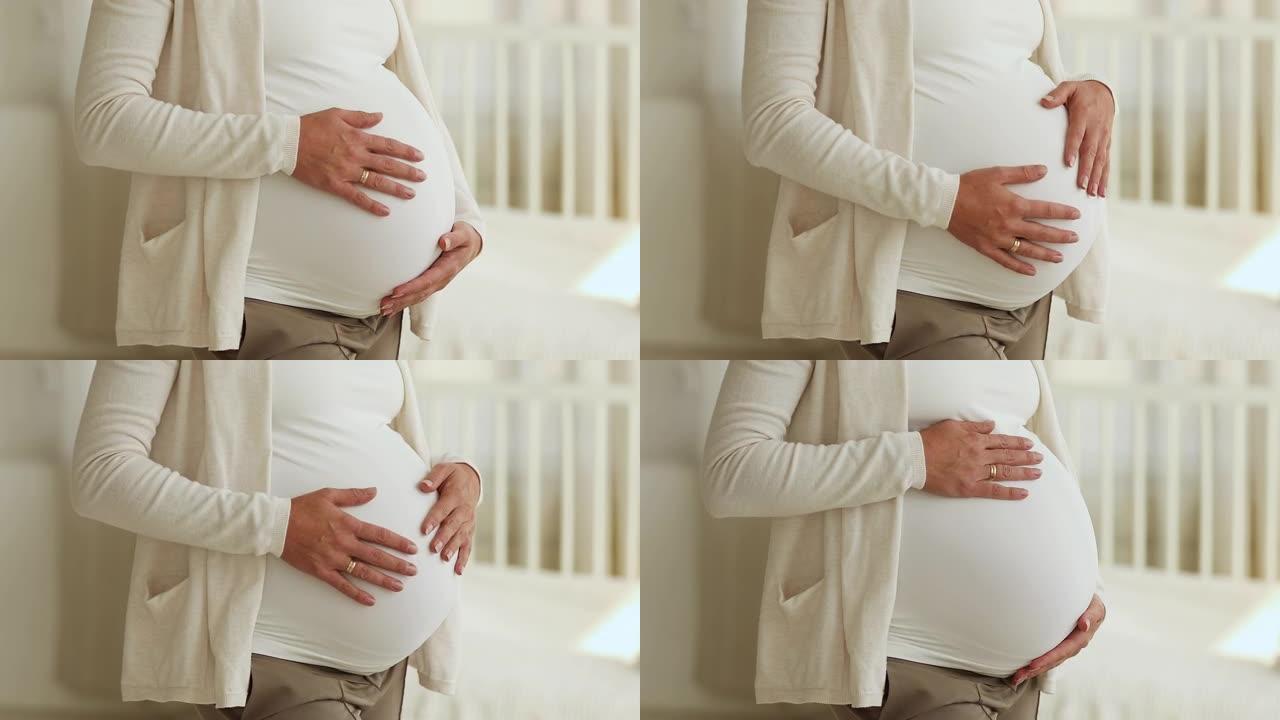 孕妇抚摸9个月大肚子的短拍