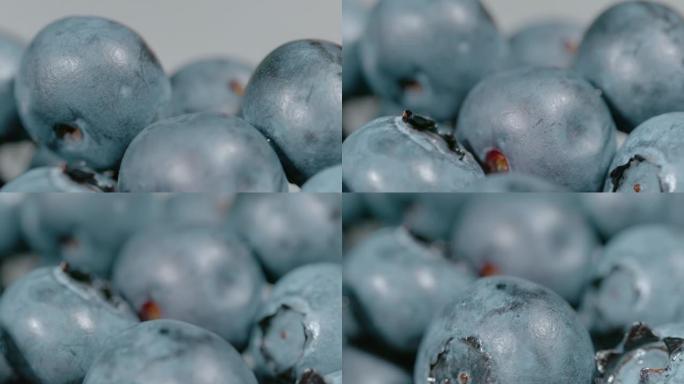 宏观，dop: 少量多汁的有机蓝莓在明亮的光线下闪闪发光。