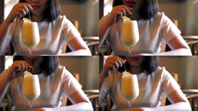 女人在咖啡馆喝果汁