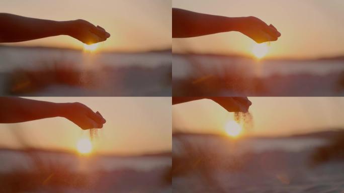 超级SLO MO (时间扭曲) 的女人的手玩沙子，意大利。