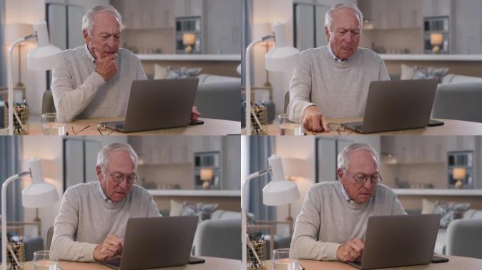 4k视频片段，一名高级男子在家中使用笔记本电脑时感到沮丧