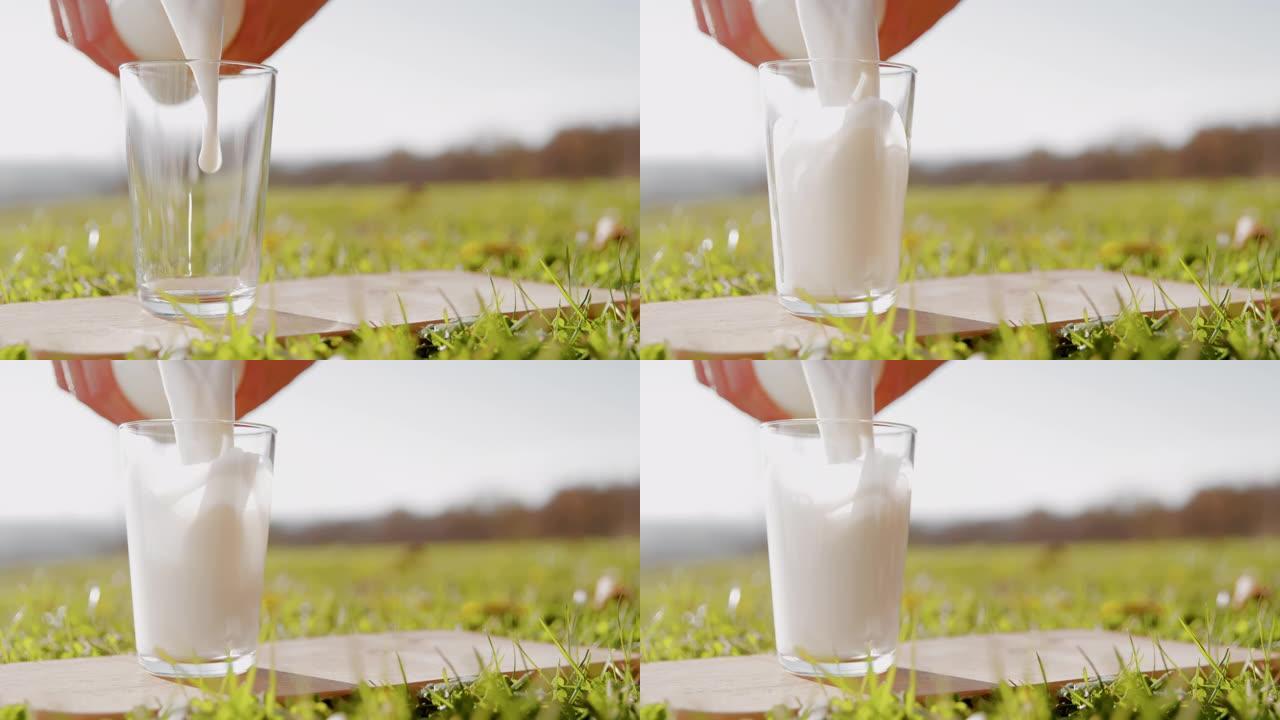超级SLO MO在美丽的晴天将牛奶倒入户外的玻璃杯中