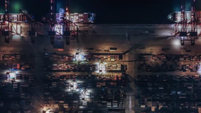 夜间集装箱运输繁忙工业港口的T/L泛无人机视图