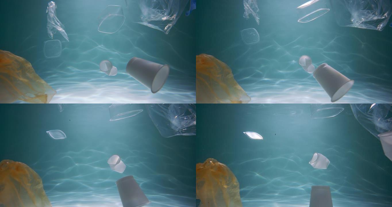 单一使用包装的问题。美丽的电影视野，塑料垃圾漂浮在水面光线下慢动作。