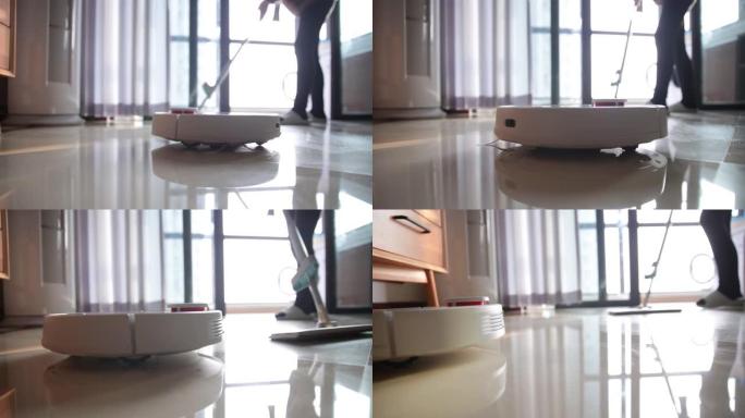 机器人吸尘器帮助妇女清洁地板
