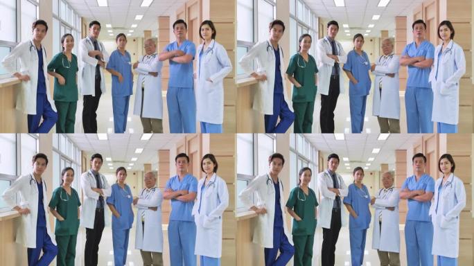 亚洲男女医疗队站在双臂交叉微笑直视镜头的肖像，自信、友好、值得信赖，站在医院背景下体现同情心。多样化