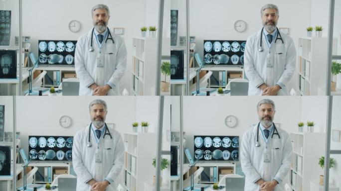 全科医生的慢动作肖像站在病房里