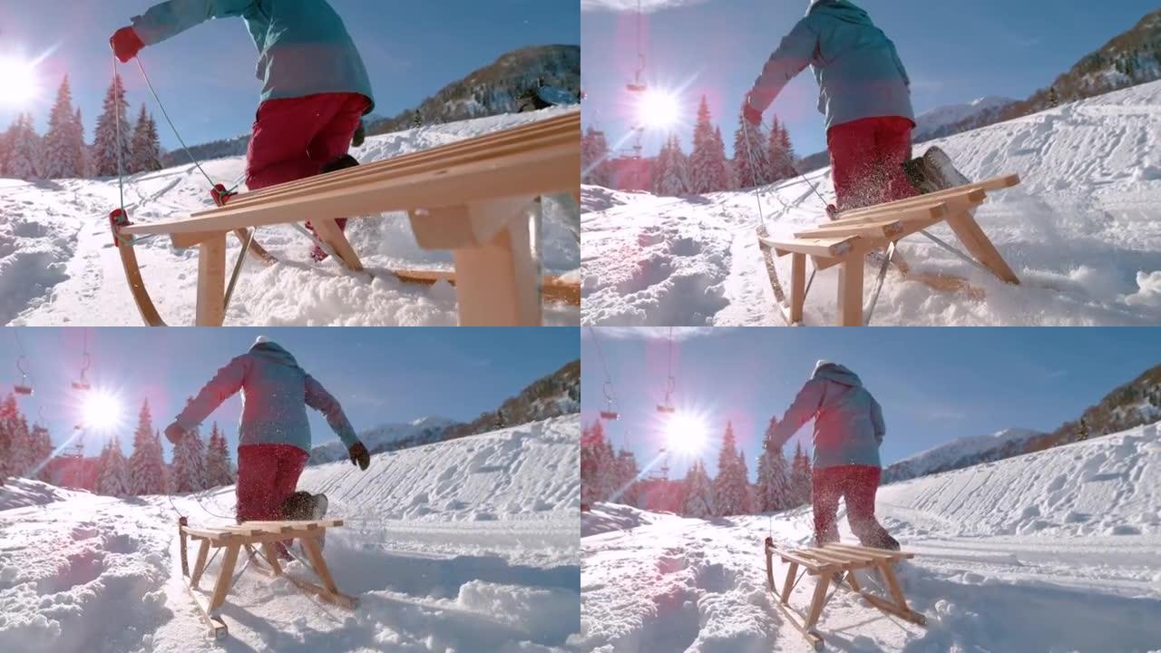 低角度: 雪橇旅行中无法辨认的女人探索空旷的滑雪胜地。