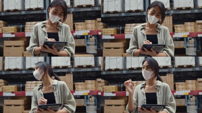 年轻的亚洲女商人经理戴着口罩在零售购物中心使用数字平板电脑检查库存水平寻找商品。