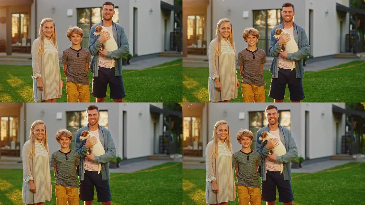 父亲微笑的父亲，母亲和儿子与父亲持有的杰克罗素梗猎犬合影的肖像。田园诗般的快乐家庭在避暑别墅后院与忠