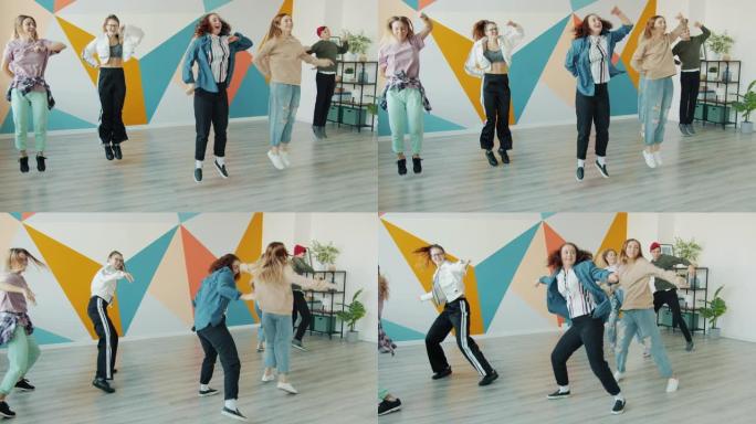 快乐青少年的慢动作在当代舞蹈工作室跳跃移动手臂跳舞