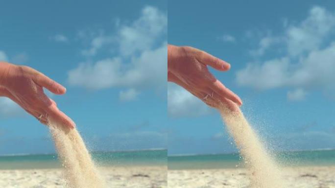 垂直慢动作: 面目全非的女人举起一把白沙。