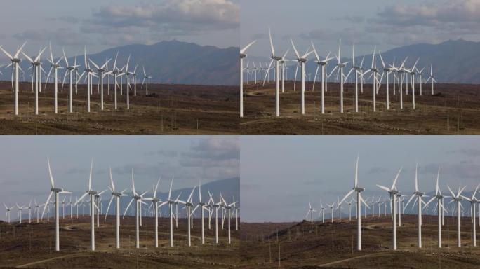 气候变化，风力发电，可持续能源，平移视图，风力涡轮机在肯尼亚图尔卡纳湖的风电场上打开