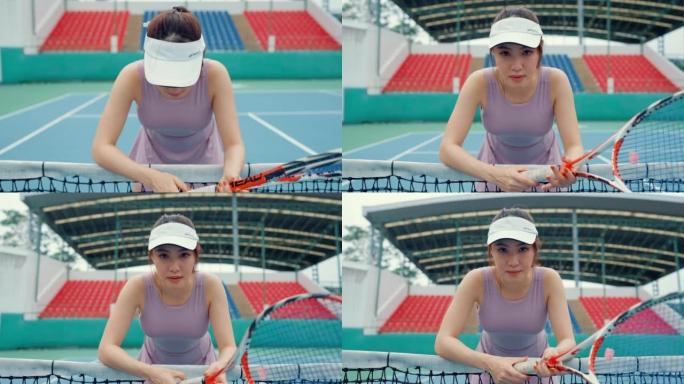 肖像亚洲年轻女子打网球身体健康。