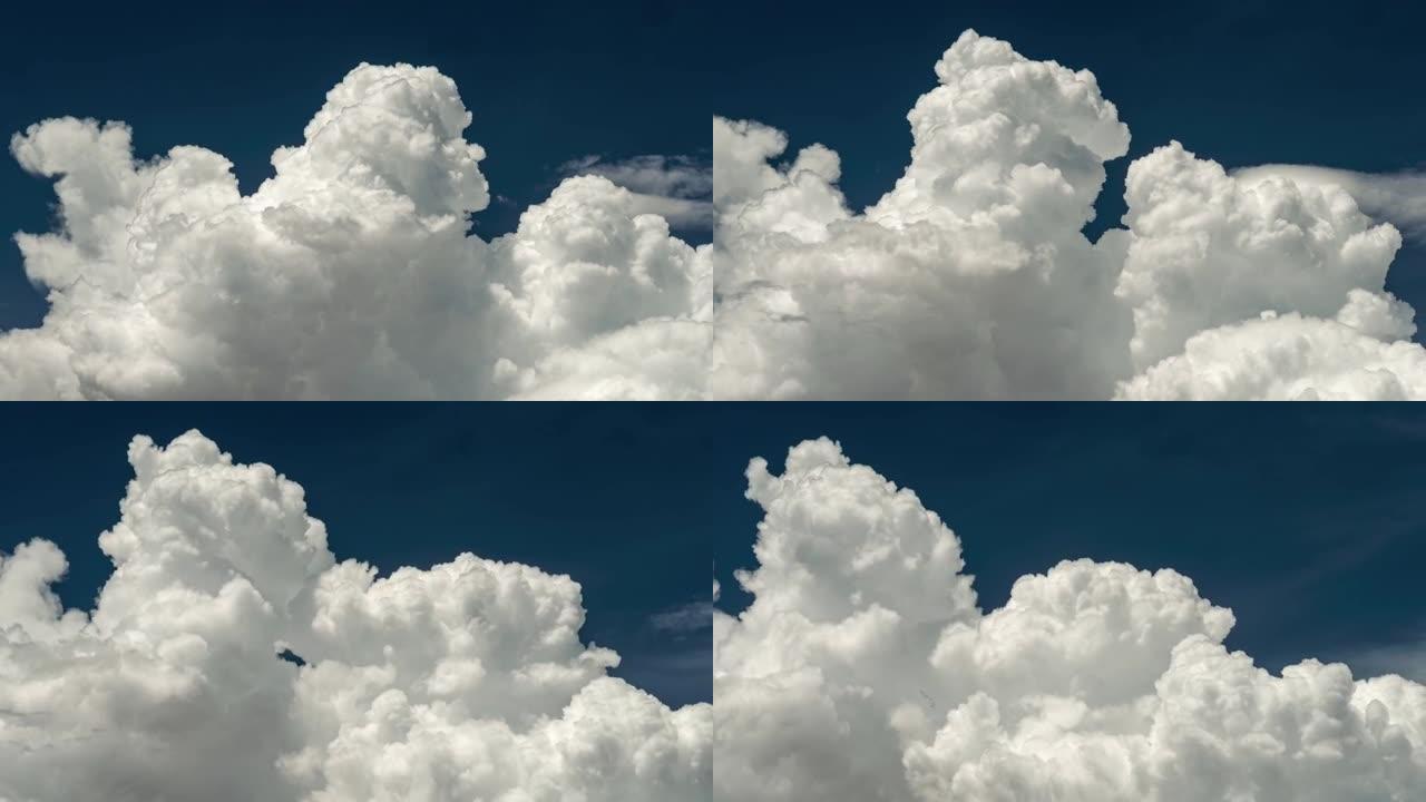 白色蓬松的大云时间流逝。白云和蓝天。UHD 4K