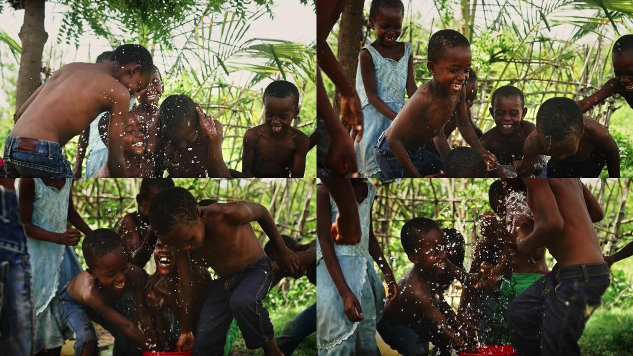 一群非洲孩子，在农村嬉笑嬉水。黑人孩子快乐地庆祝生活。镜头捕捉了童年的美丽，村庄生活的天真和纯洁