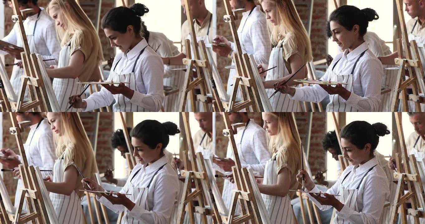 一群不同的学生在艺术学院上绘画课