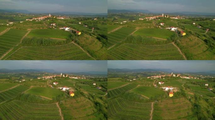 空中: 著名葡萄酒产区一个山顶村庄的电影鸟瞰图。