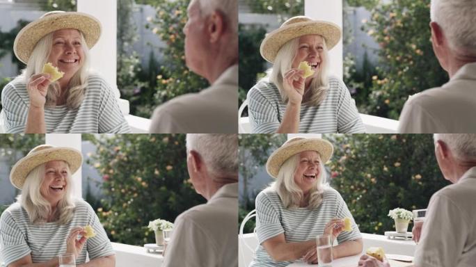 一名老人坐在外面吃菠萝喝水的4k视频片段