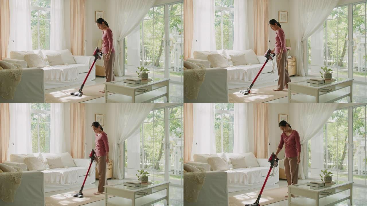 家庭主妇用吸尘器打扫房子