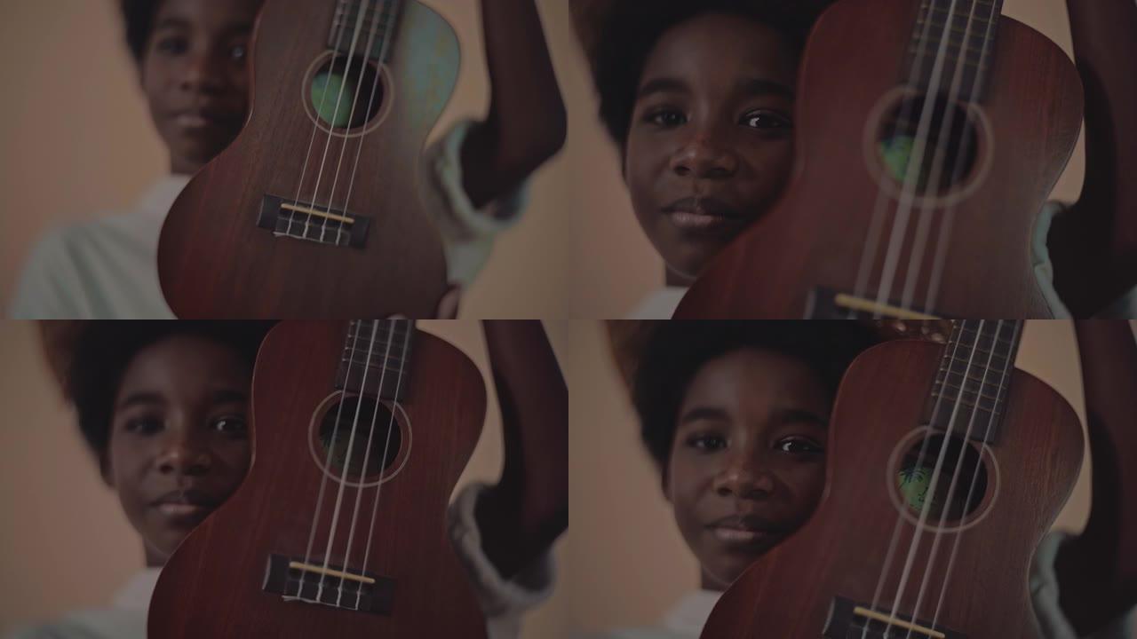 尤克里里男孩儿童乐器吉他演奏吉他课程