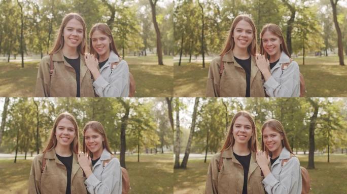 公园中幸福的双胞胎姐妹的肖像