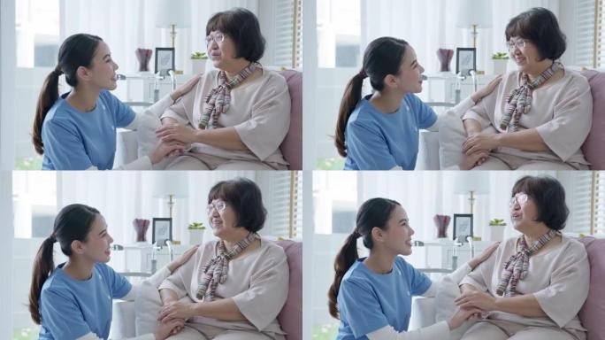 年轻的亚洲妇女或护士家庭护理手在高级祖母肩膀上给予支持同情老年妇女或老年人在辅助生活家庭护理精神卫生
