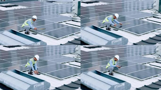工程师正在安装太阳能电池板，可再生能源和光伏。工程技术人员或电工在建筑物屋顶上进行维护，并使用平板电
