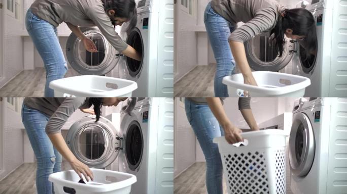 亚洲妇女用洗衣机洗衣服
