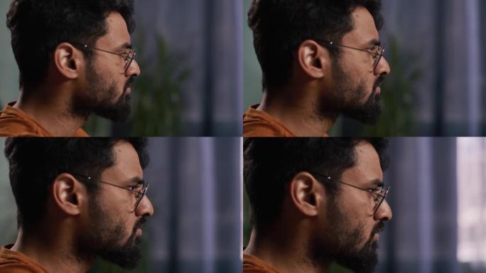 大胡子的印度男子使用电脑