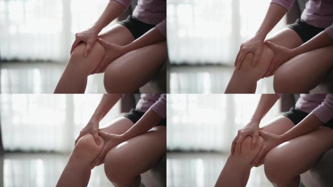 膝盖疼痛的女人的裁剪视图