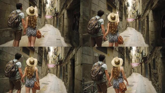4k视频片段，一对无法识别的夫妇牵着手在巴塞罗那的街道上行走