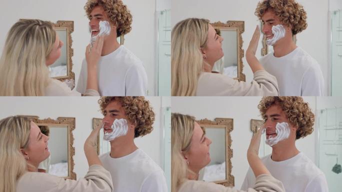 夫妇，剃须和浴室用泡沫去除面部毛发，同时说话，快乐和恋爱，在早上例行卫生。女人帮助男人脱毛或刮胡子，