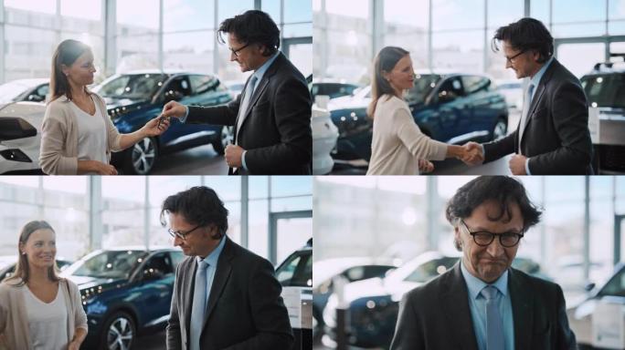 SLO MO汽车推销员交出钥匙并与一位女顾客握手