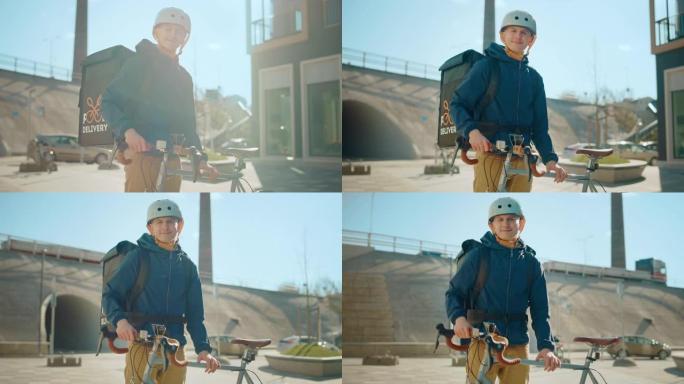 在时尚的现代市区，快乐的送餐男子穿着保暖背包站在自行车旁边。微笑快递员递送餐厅订单的肖像。慢动作中弧