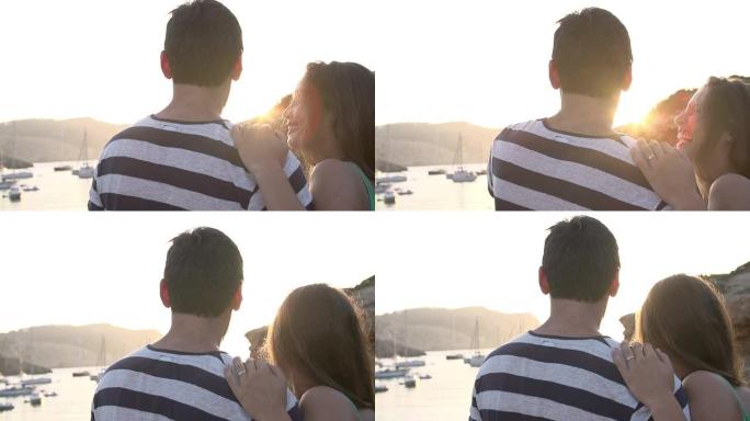 夫妇在港口观看日落的慢动作镜头