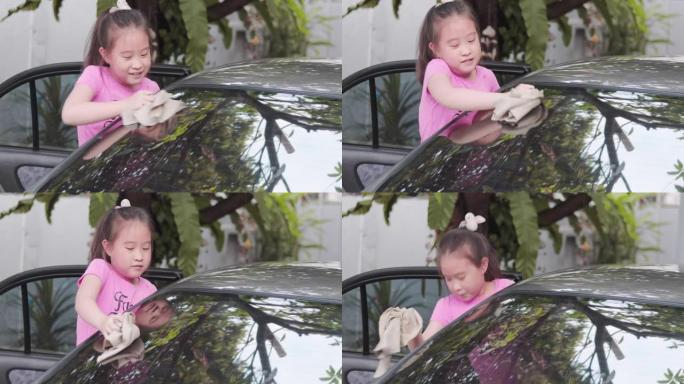 女孩帮妈妈洗车小女孩做家务假日