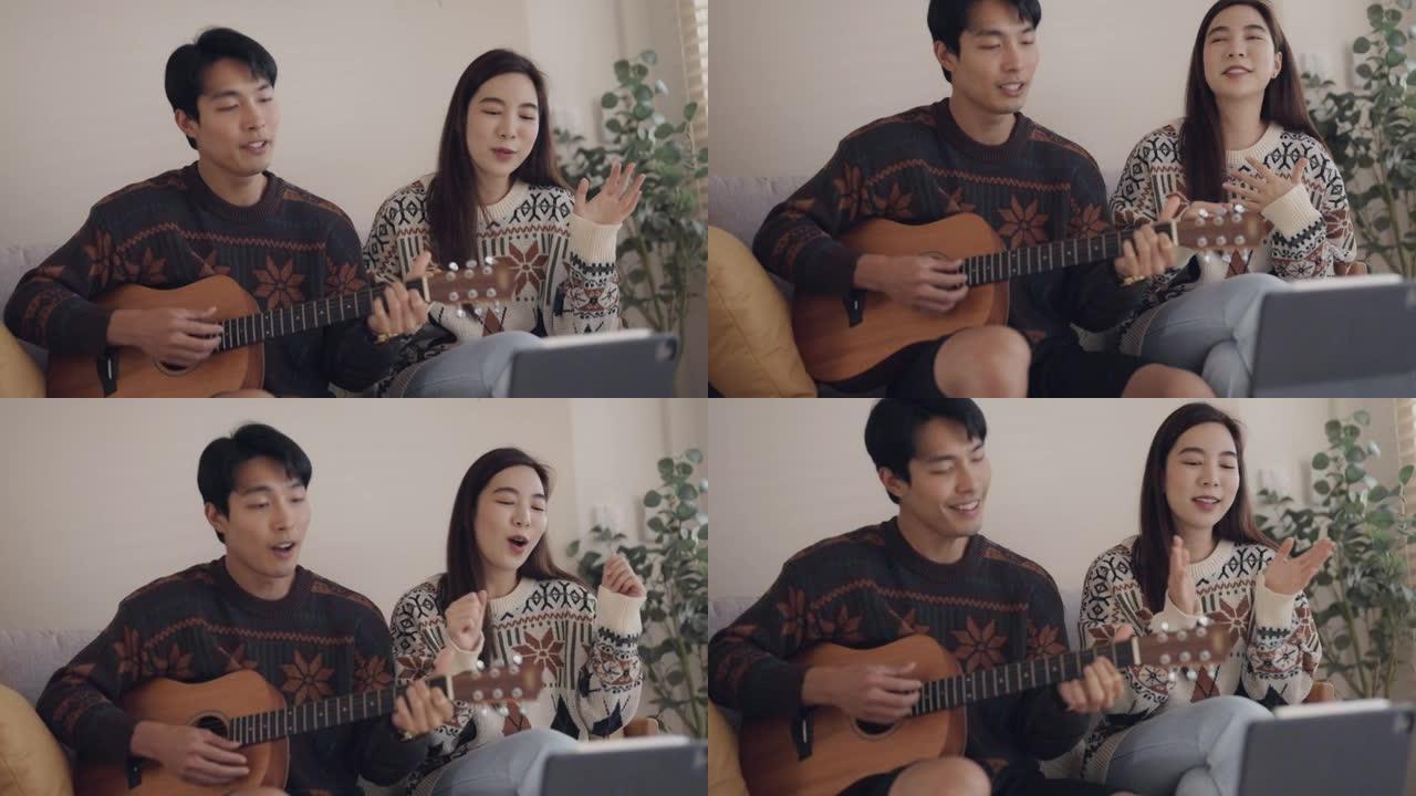 年轻夫妇在客厅一起唱歌玩得开心