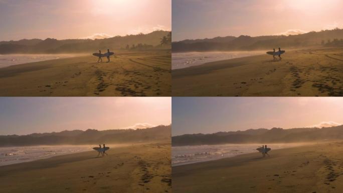 慢动作: 几个冲浪者在金色日落时进行日落冲浪