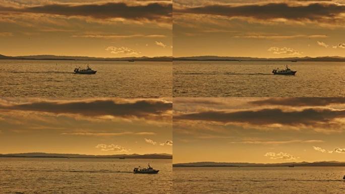 渔船在日落时返回港口