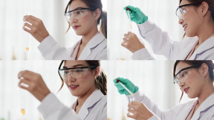 亚洲女科学家在实验室，显微镜测试和研究中工作
