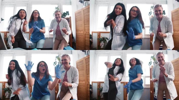 战胜疾病。放大三位有趣的多民族快乐女医生在诊所办公室一起做史诗般的舞蹈。