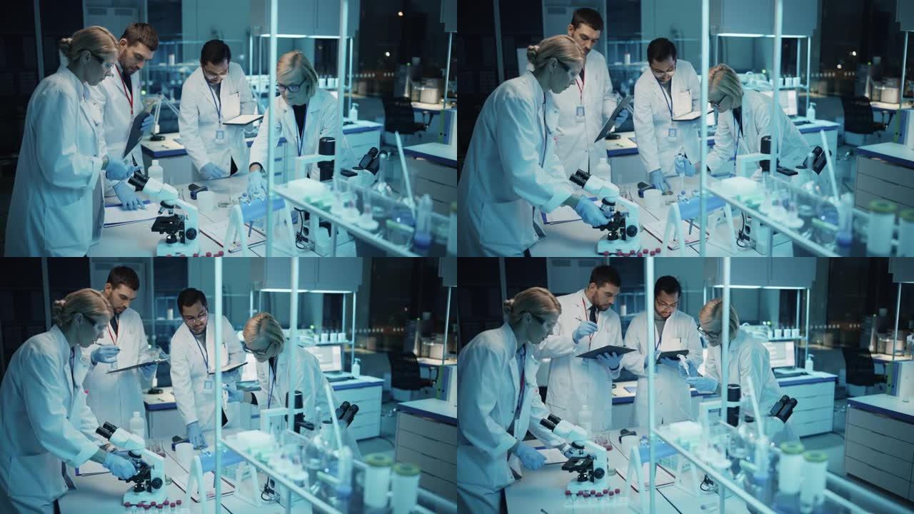 医学研究科学家团队在试管和显微镜载玻片中的DNA样本的帮助下开会并进行实验。应用科学实验室，拥有多元