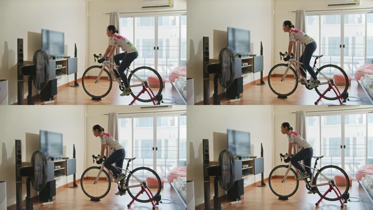 亚洲运动女子在家健身自行车