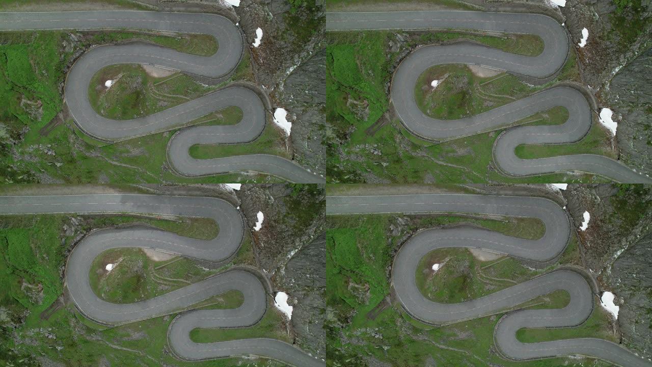 空中自上而下: 风景秀丽的Gothardpass的一条折返路的无人机视角。