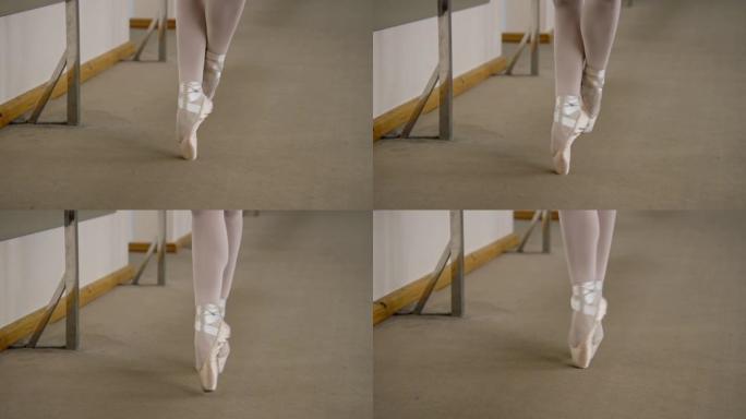 近距离站立脚尖的芭蕾舞女演员的脚