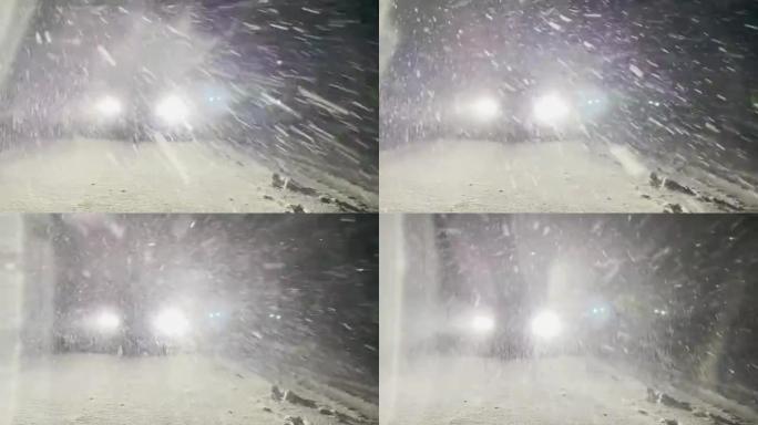 跑车的明亮发光二极管前灯在冬天的夜晚照亮了雪道。